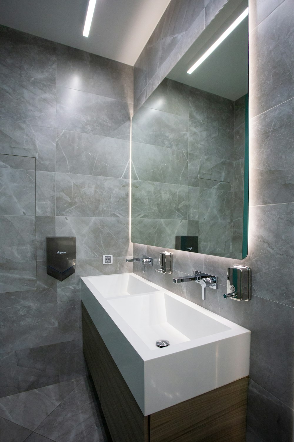 white ceramic sink with stainless steel faucet