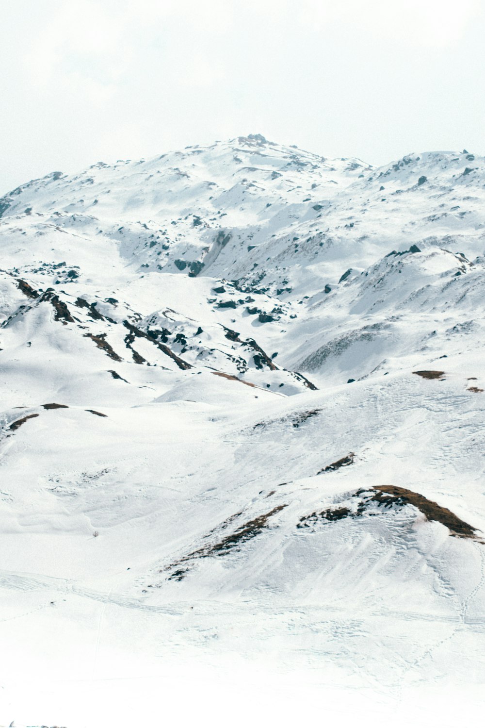 snow covered mountain during daytime