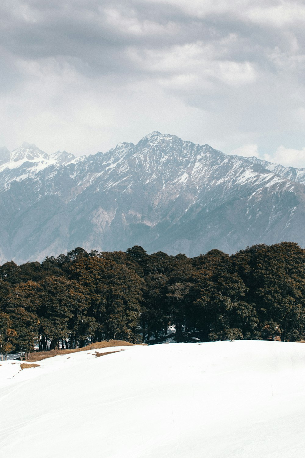 a man riding skis on top of a snow covered slope