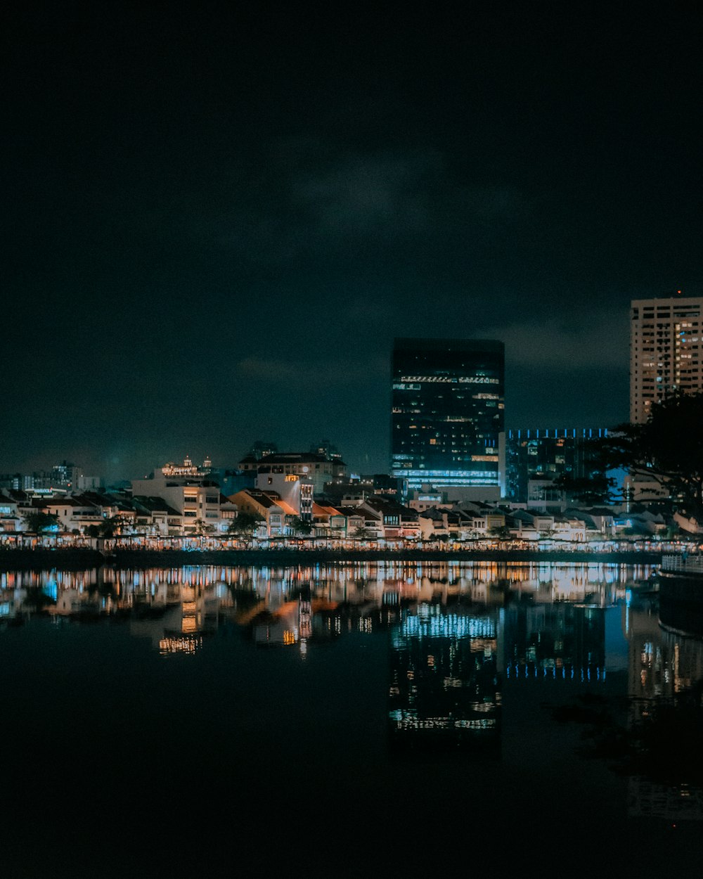 a night view of a city and a body of water