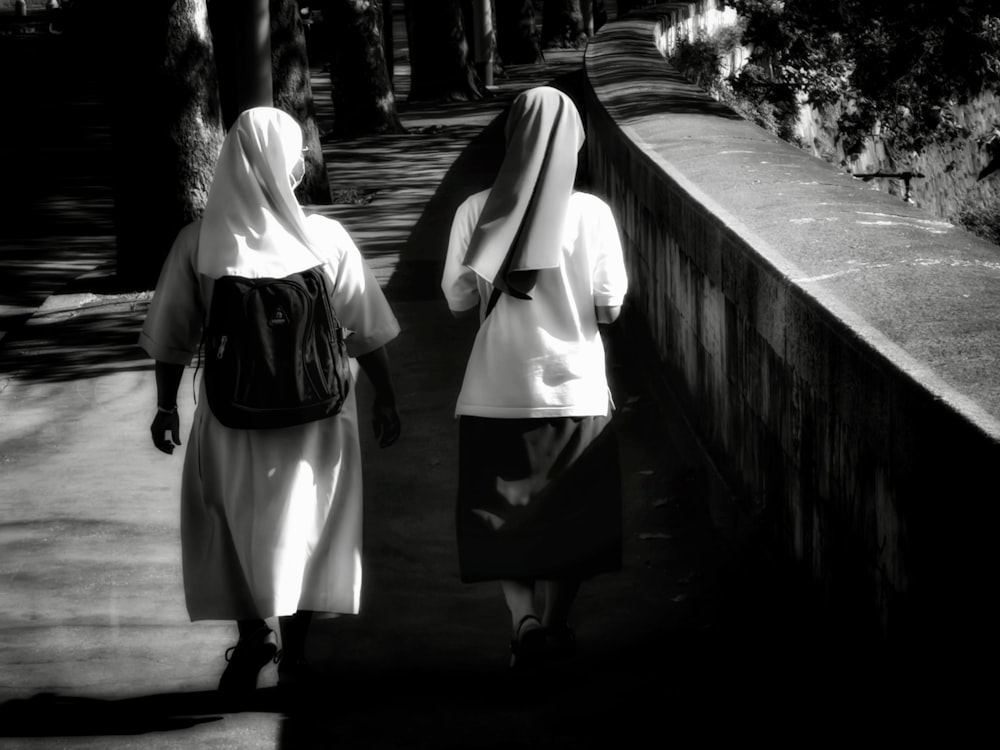 2 women walking on the bridge