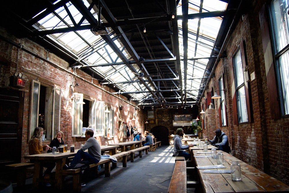 a group of people sitting at tables in a room