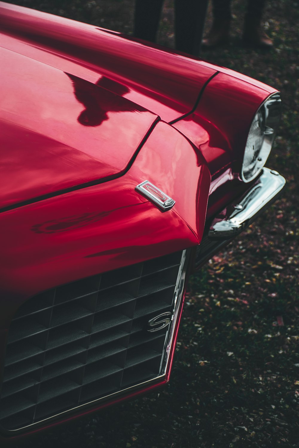 red car with white and black license plate