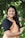 woman in black cardigan smiling