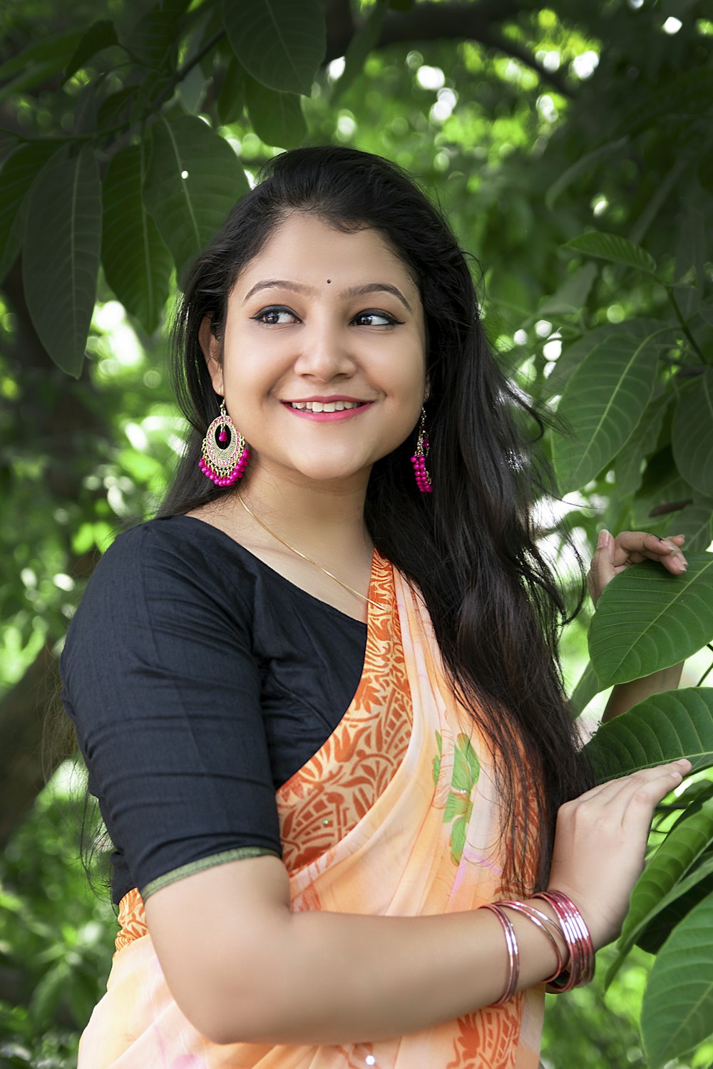 woman in black cardigan smiling