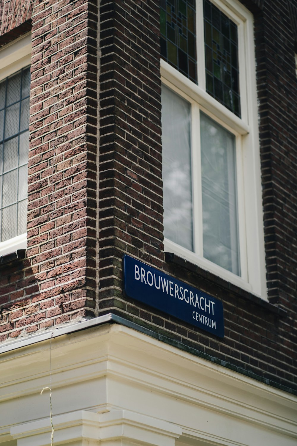 brown brick building with glass window