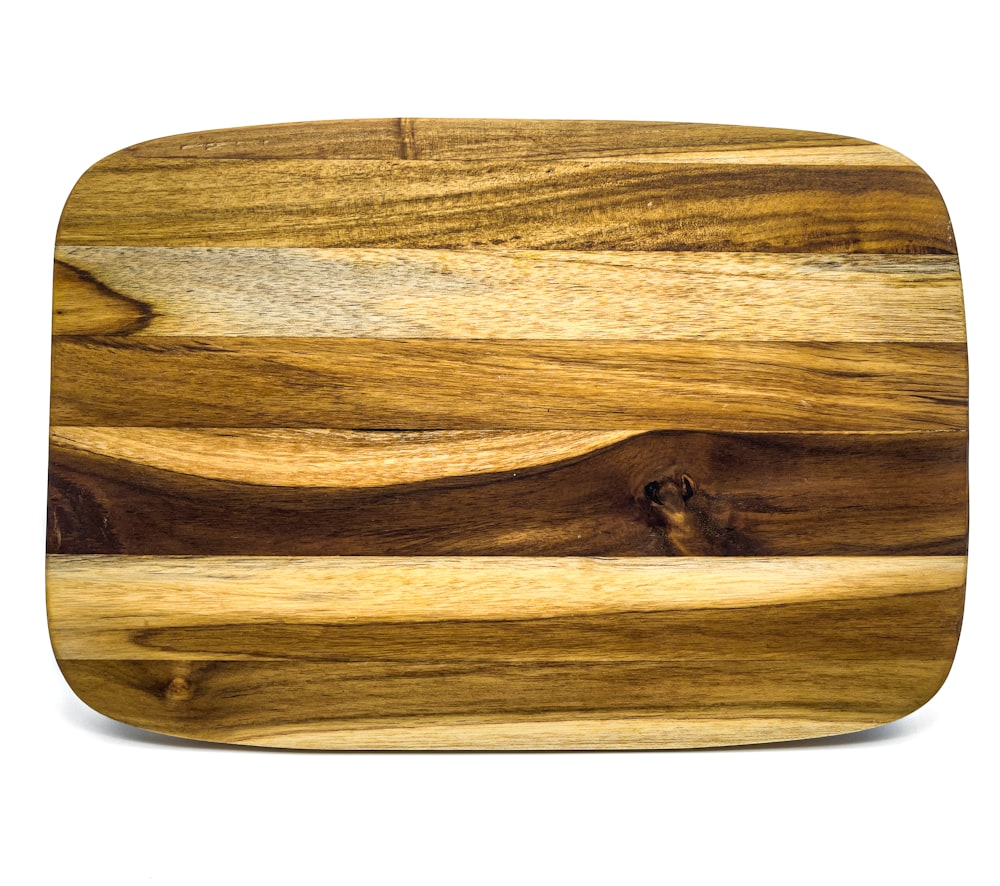 brown wooden chopping board with white background