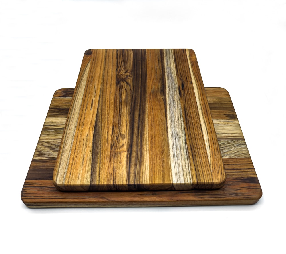 brown wooden chopping board on white background