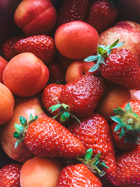 red strawberries on brown wooden table