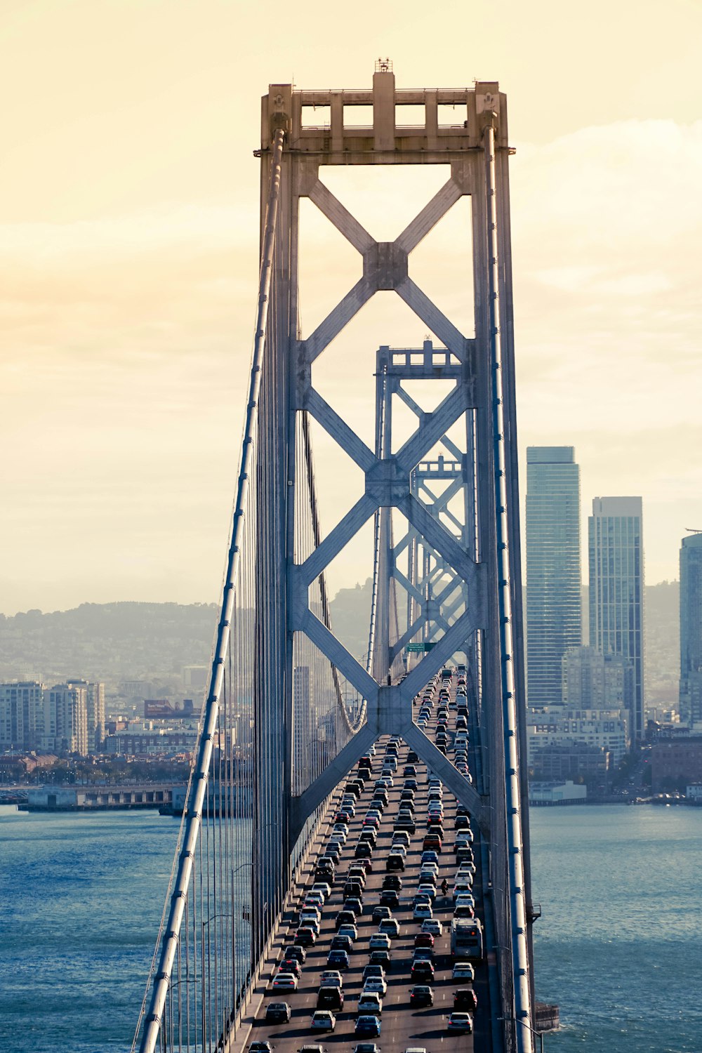 gray bridge over body of water during daytime