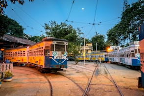 yellow and white tram on road during daytime