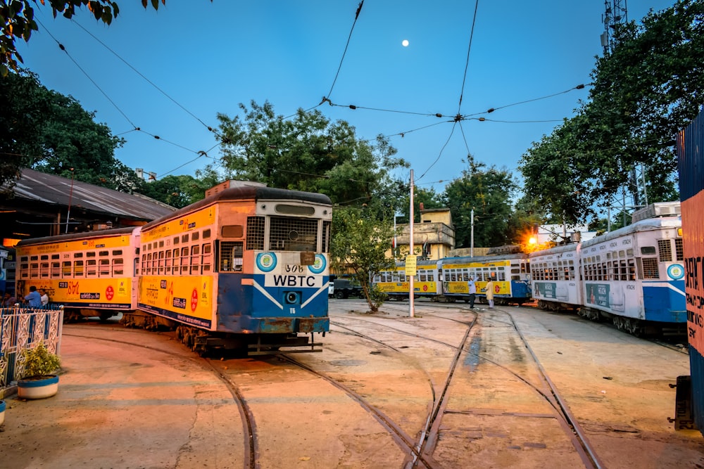 yellow and white tram on road during daytime