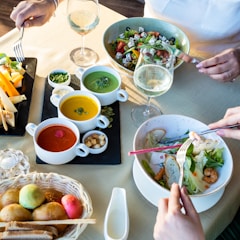 person holding chopsticks and bowl of vegetable salad