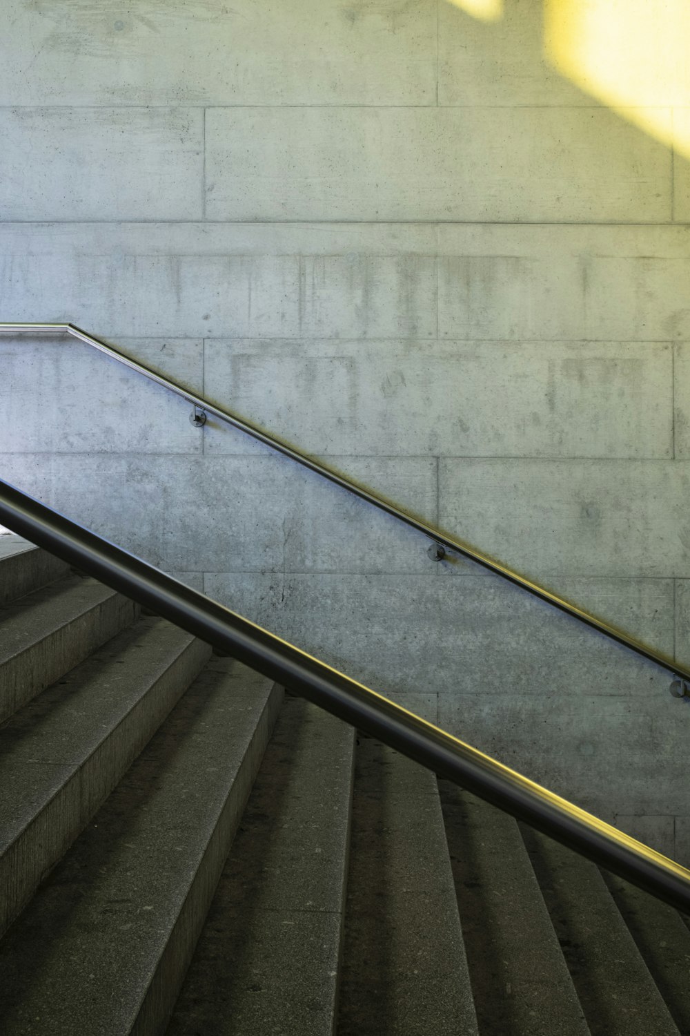 black metal staircase with stainless steel railings