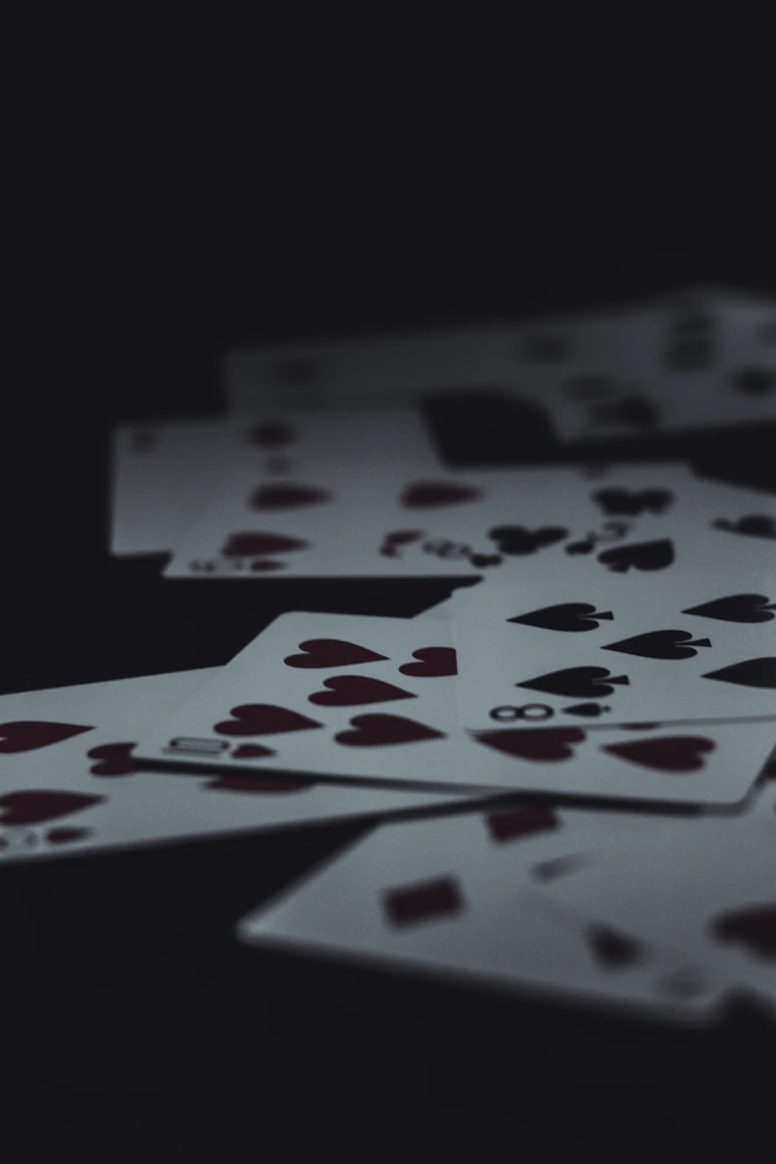 A playing card on a dark background