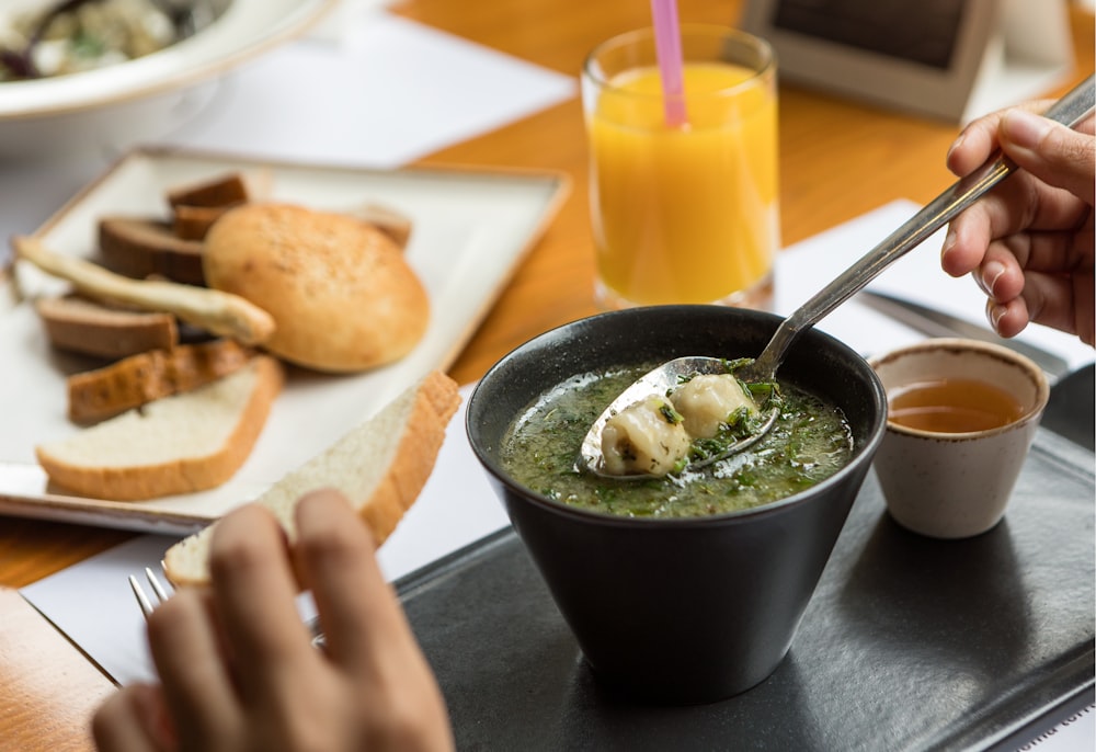 green ceramic bowl with soup