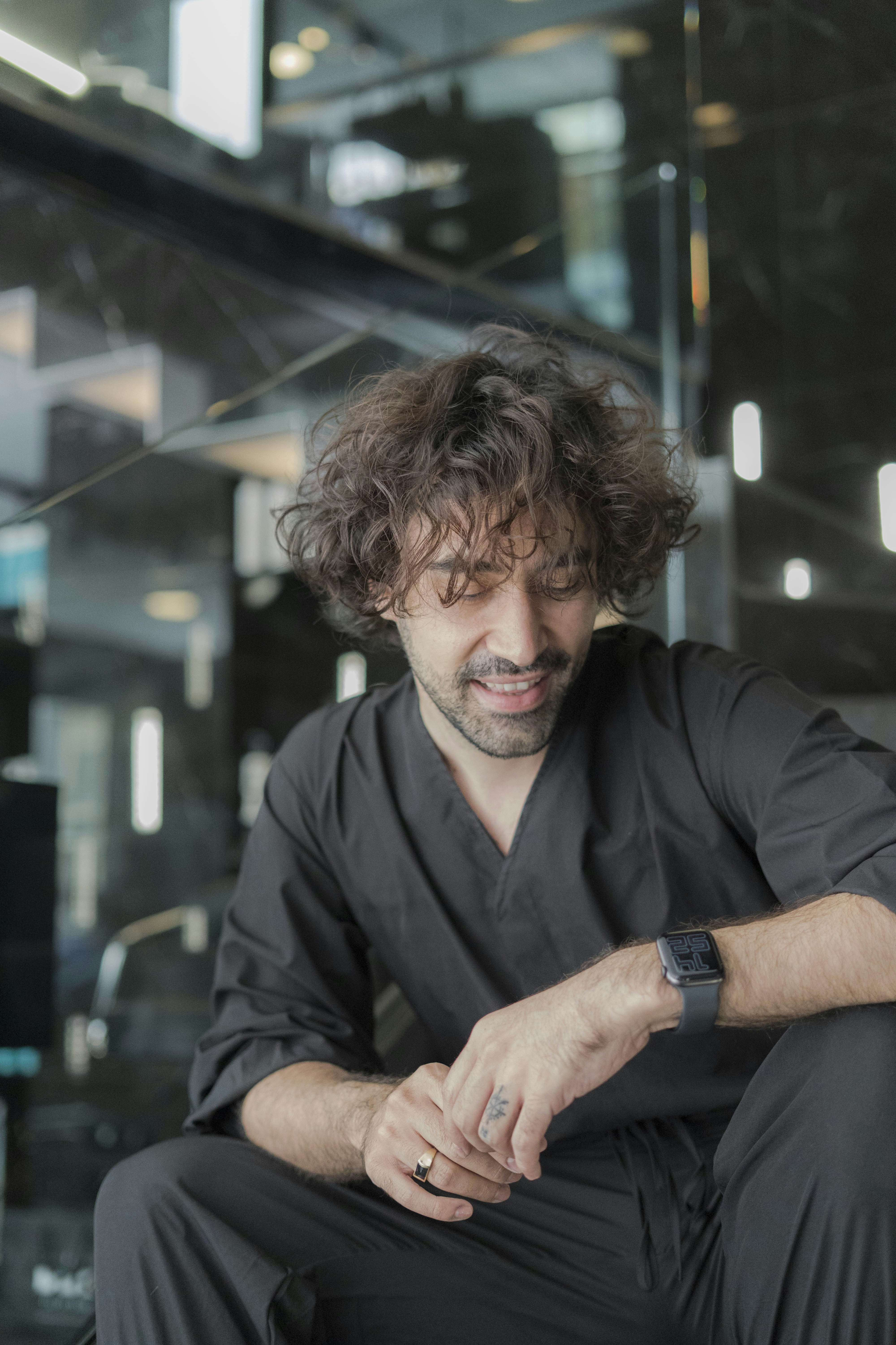 man in black dress shirt wearing black watch