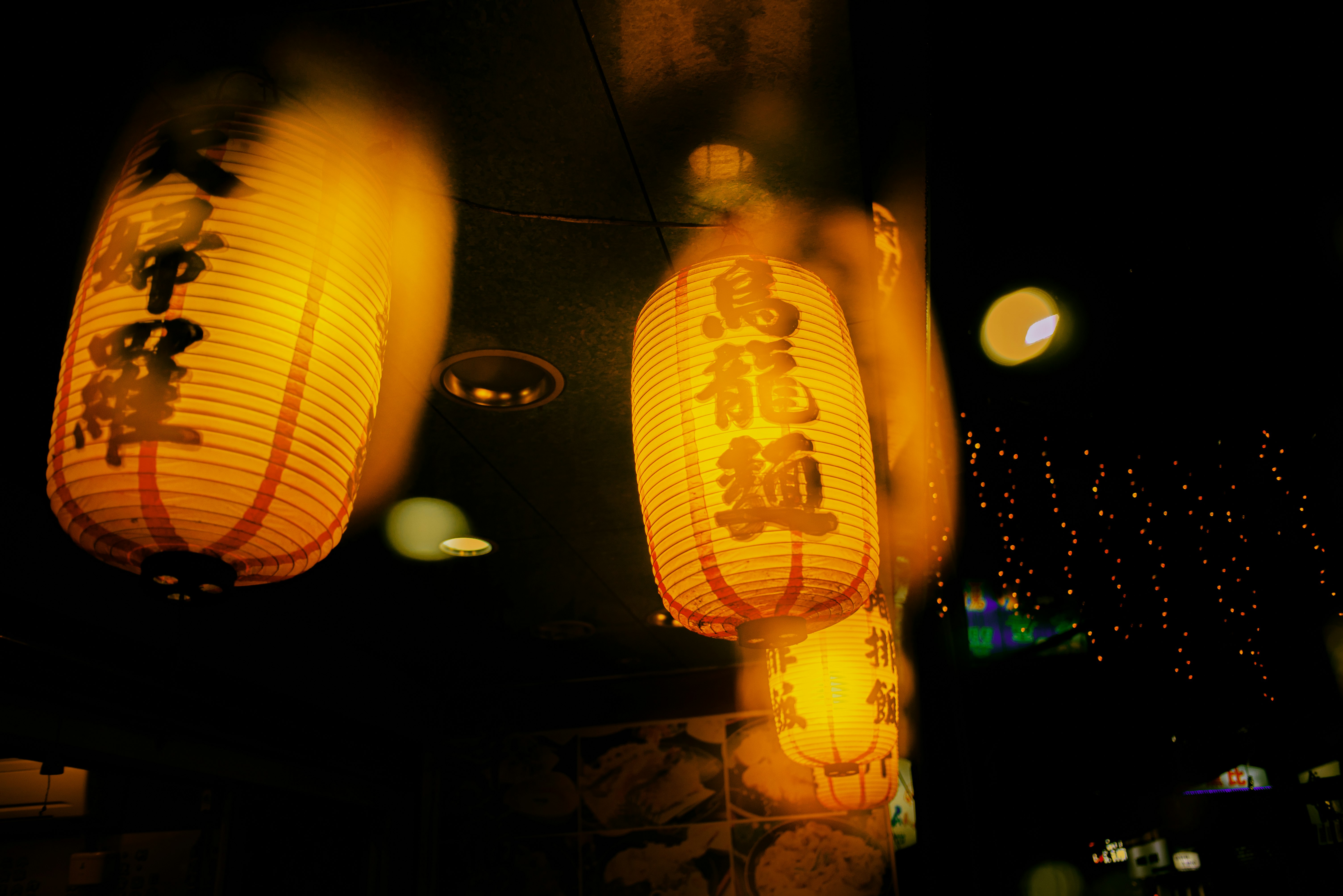 yellow paper lanterns on ceiling