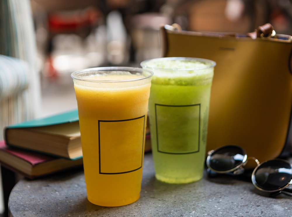 clear drinking glass with yellow liquid