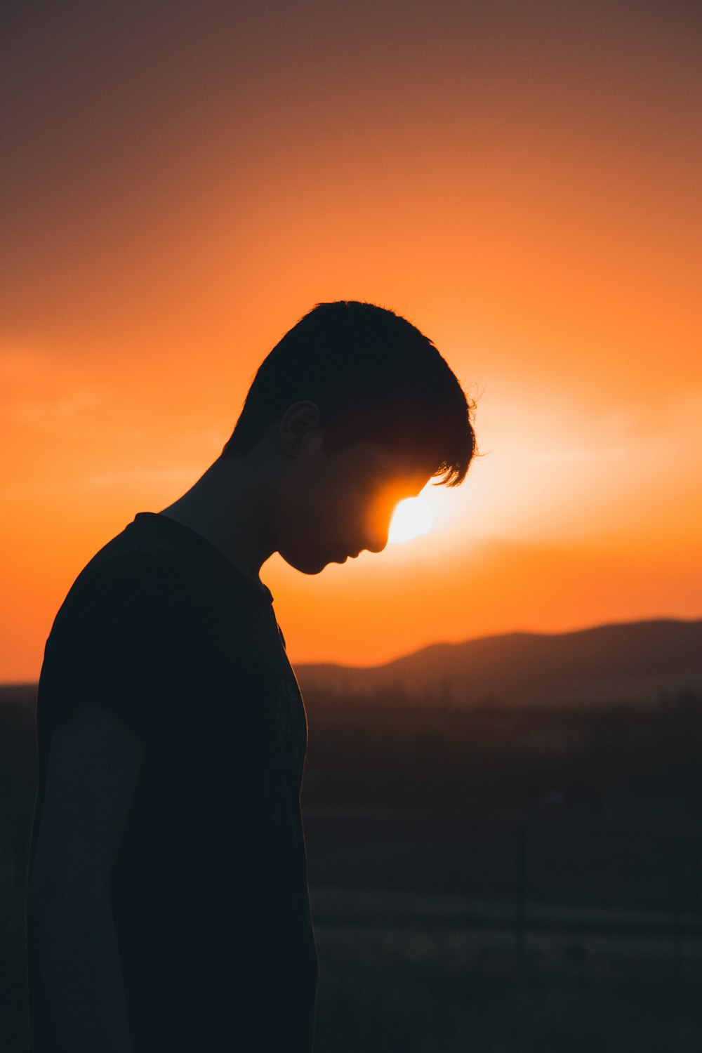 silhouette of man during sunset