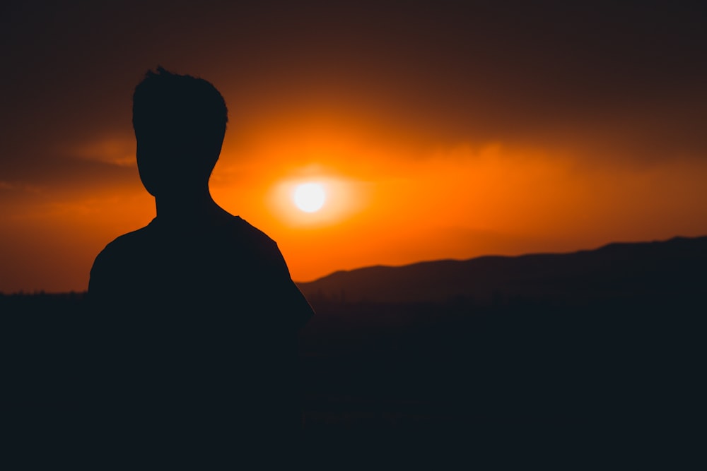 silhouette of man during sunset