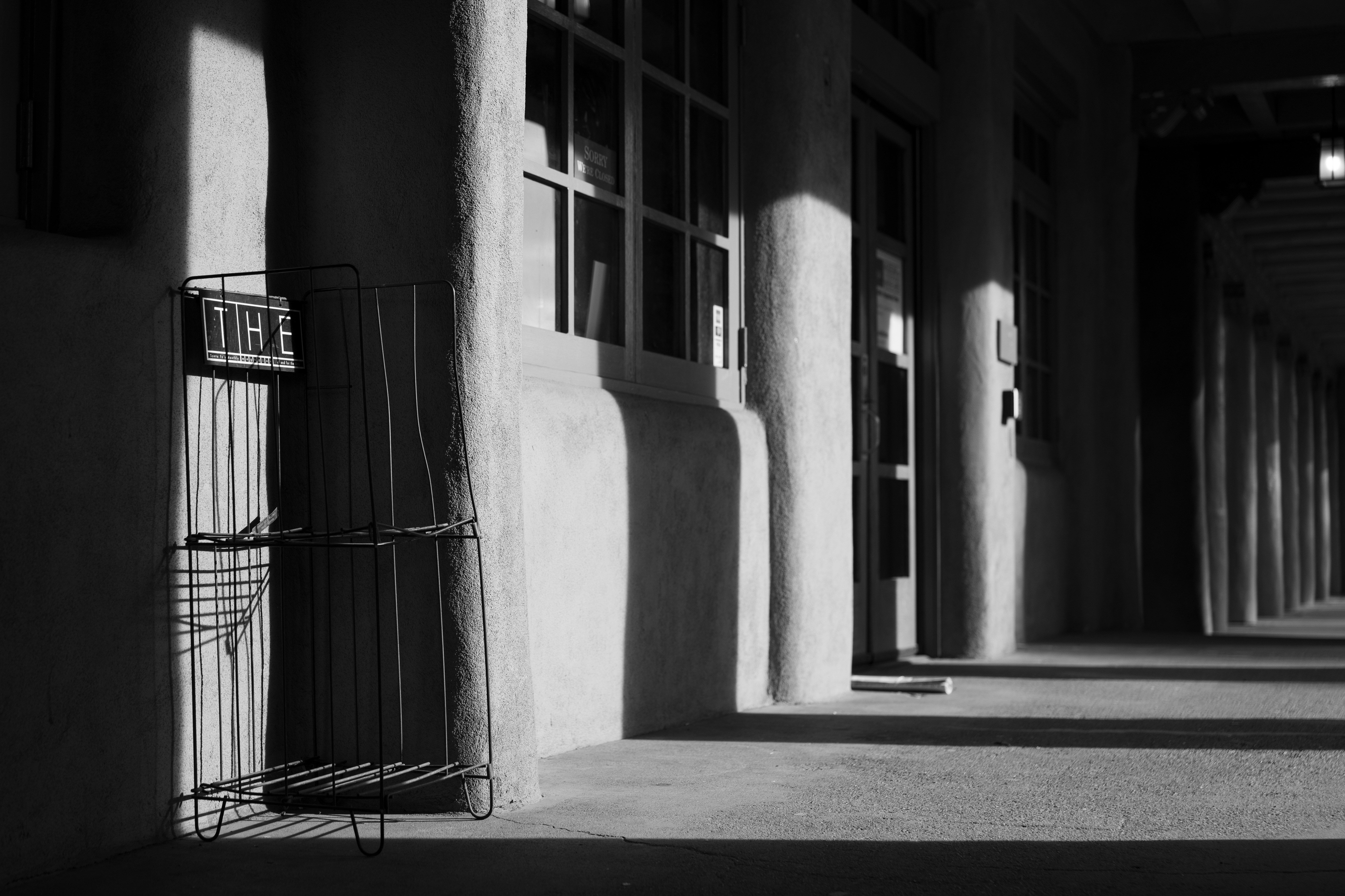 black metal gate on white concrete building