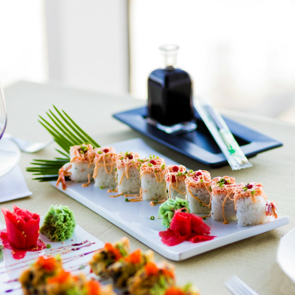 white ceramic plate with stainless steel fork and knife