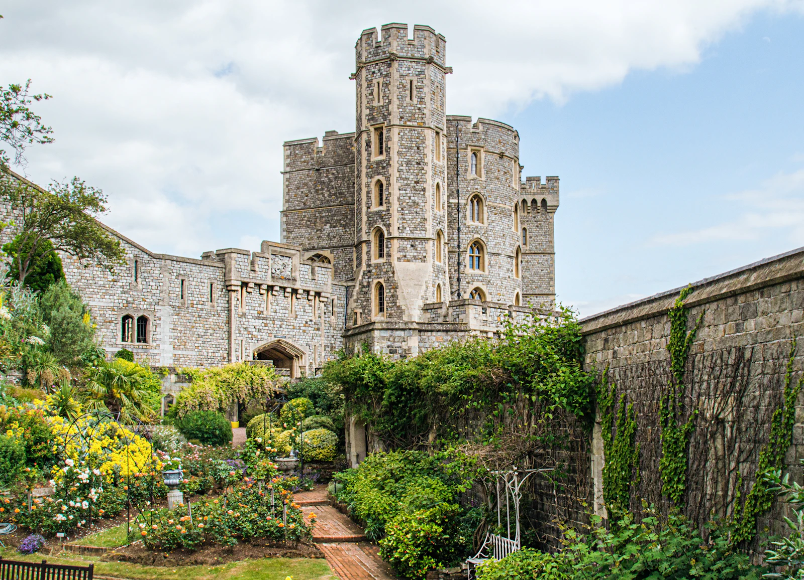 A grey stone castle against a blue sky