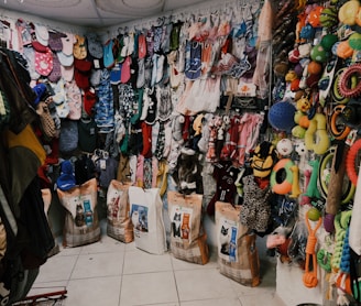 assorted clothes on white steel rack