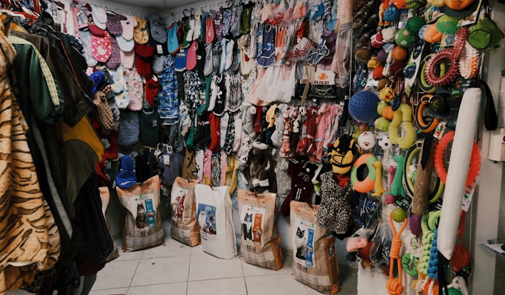 assorted clothes on white steel rack