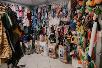 assorted clothes on white steel rack