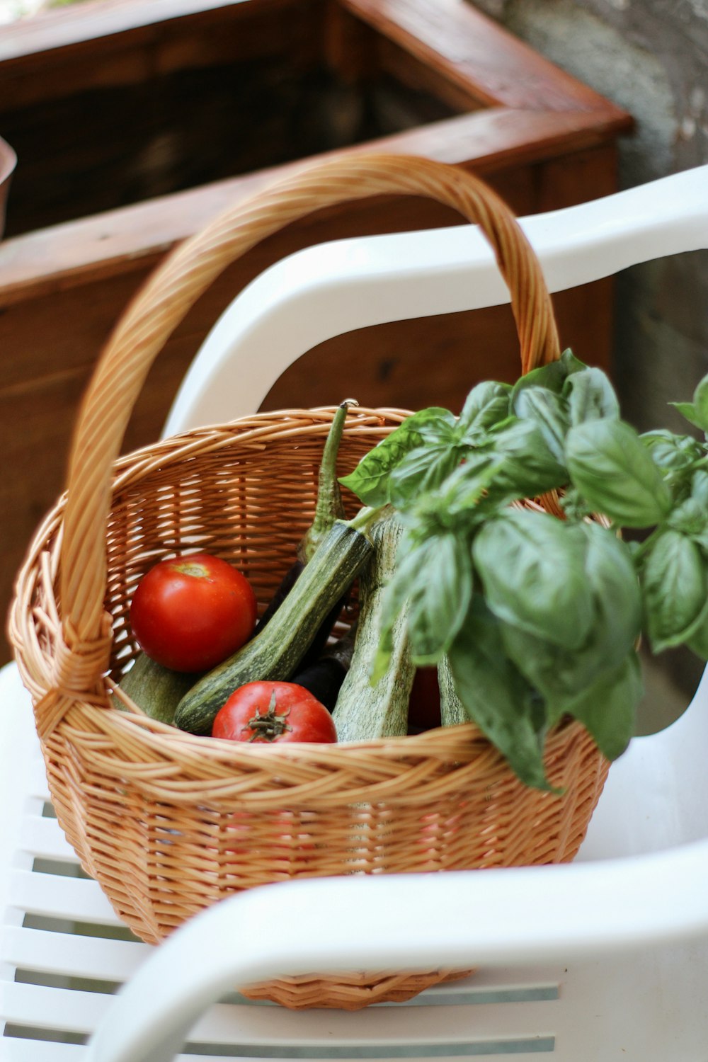 red apple fruit on brown woven basket