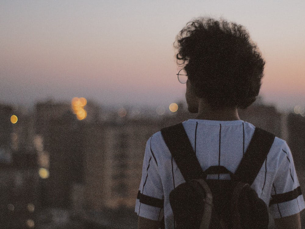 man in white and black striped shirt