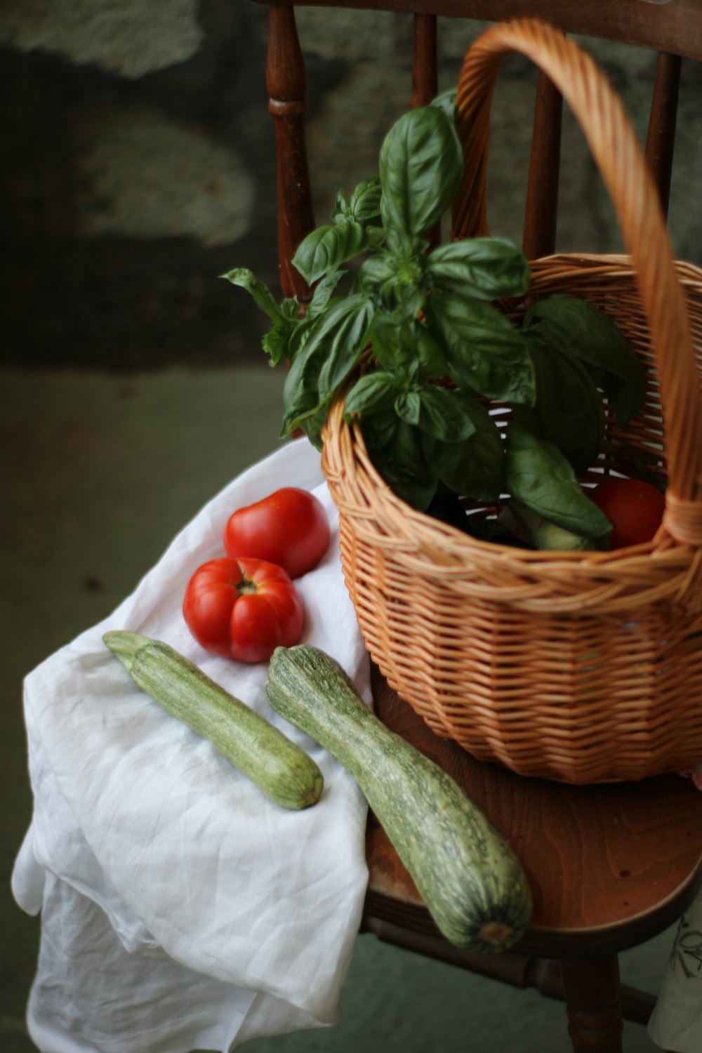 red tomatoes on brown woven basket