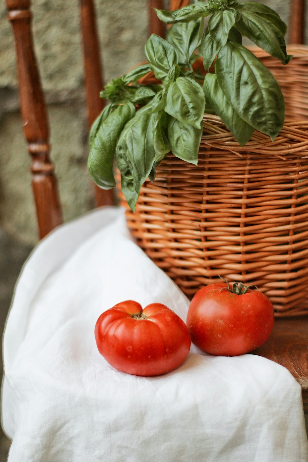 red tomato on white textile