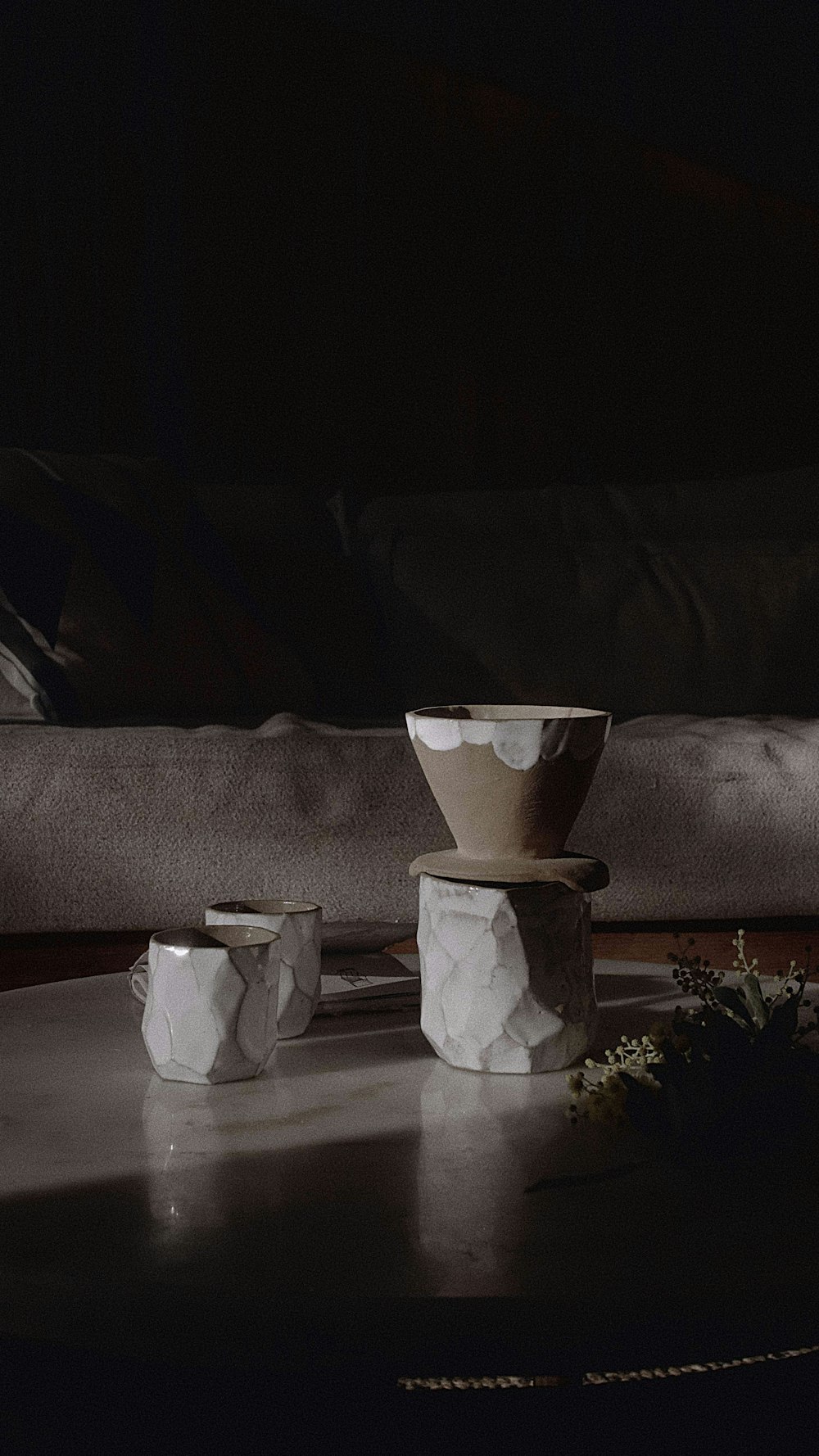 white ceramic vase on white table cloth