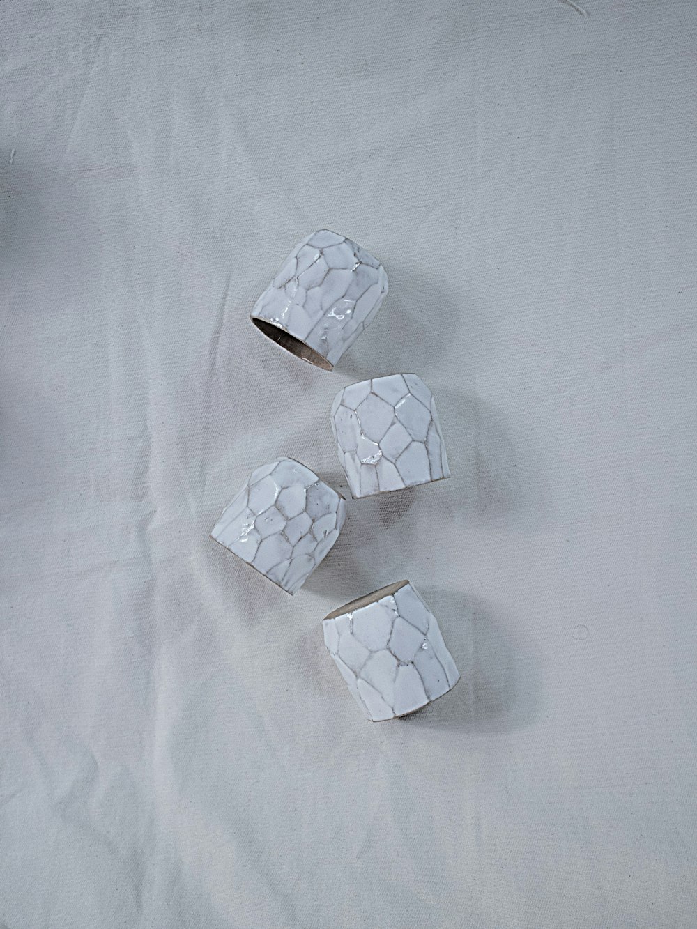 white cube on white textile