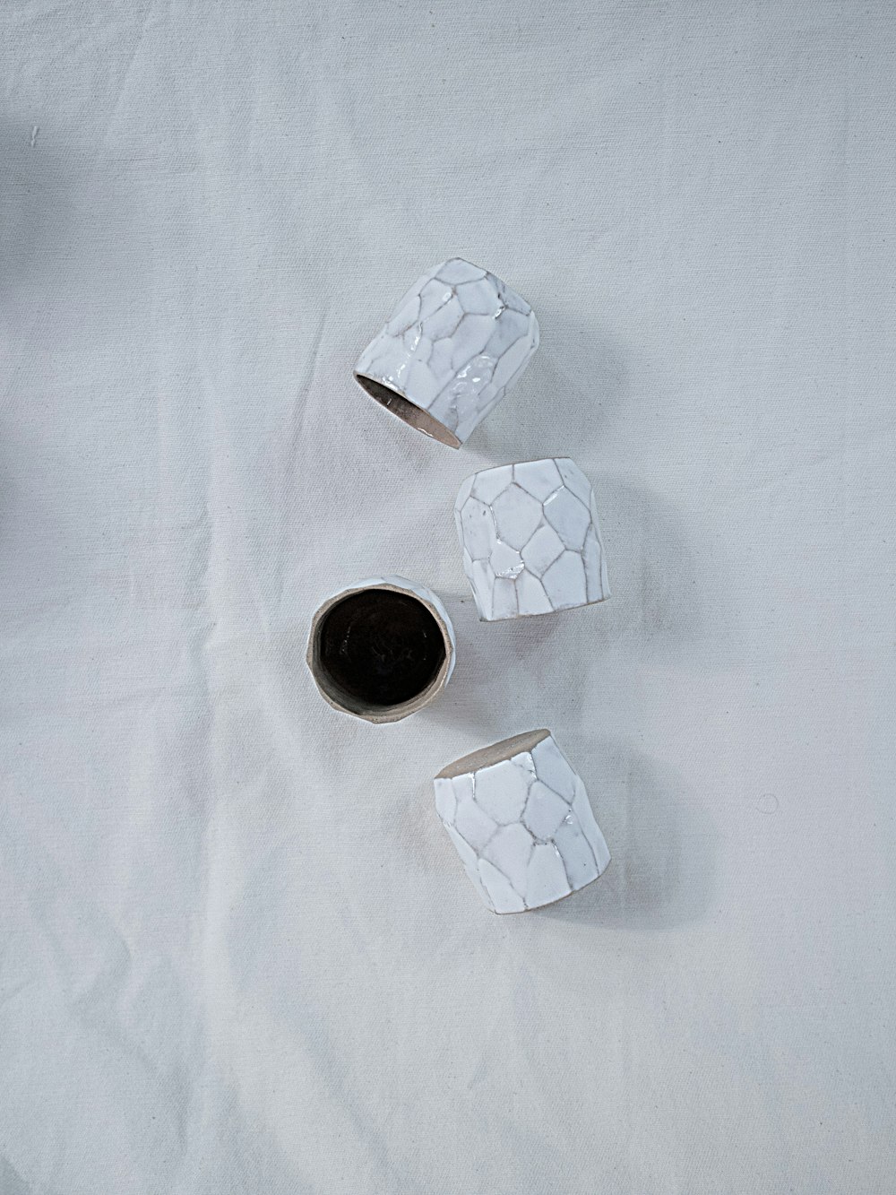 white round ornament on white textile