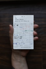 person holding white paper document
