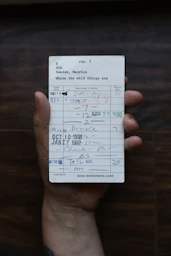 person holding white paper document