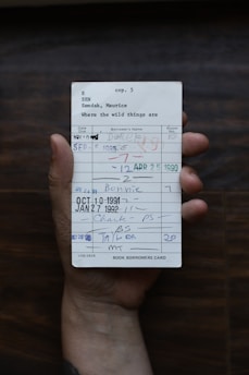 person holding white paper document