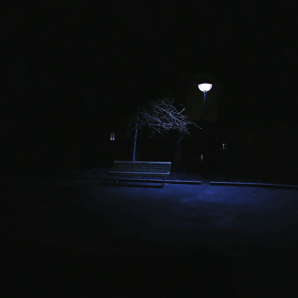 white light post turned on during night time