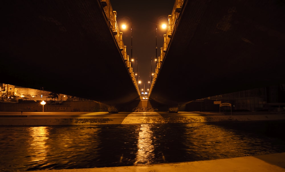 bridge over water during night time