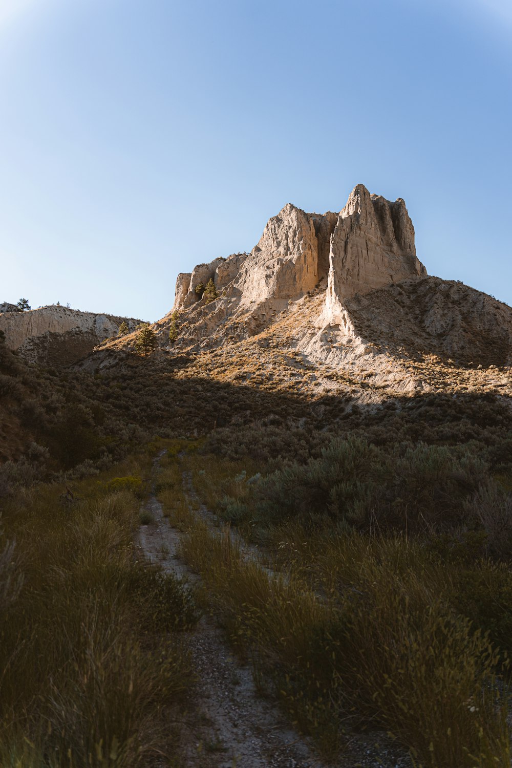 brown rocky mountain under blue sky during daytime