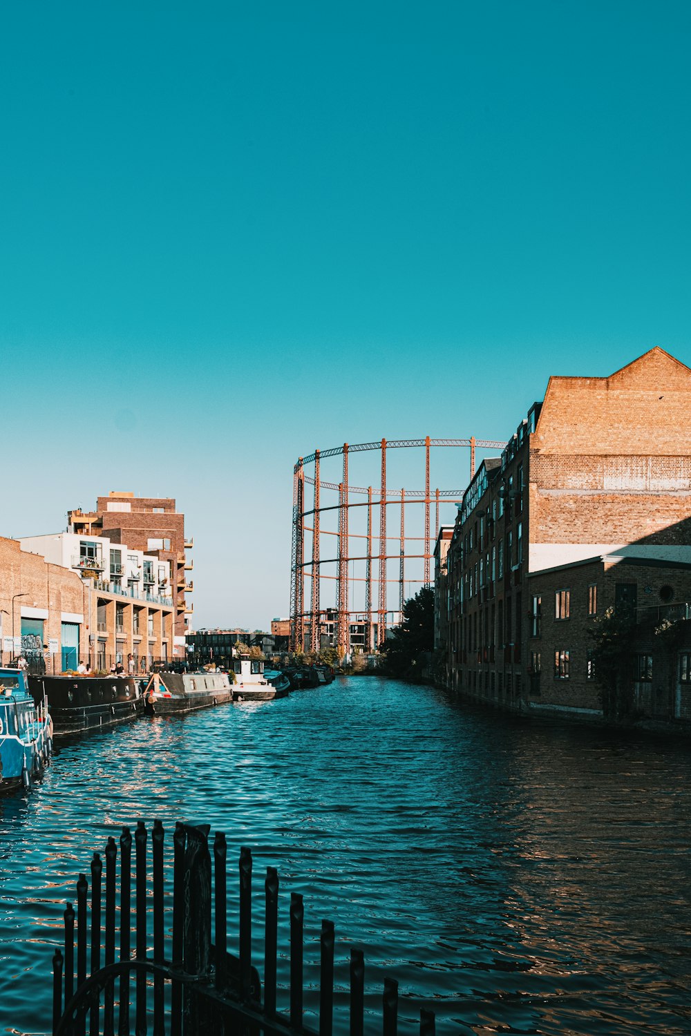 body of water between buildings during daytime