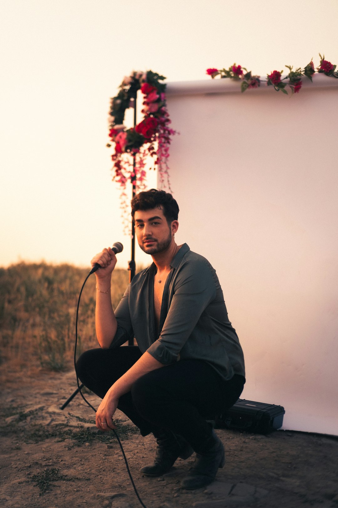 man in black long sleeve shirt sitting on black chair