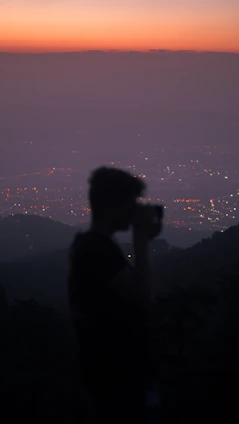 A candid photo of the blog author capturing Monterrey's cityscape during golden hour.