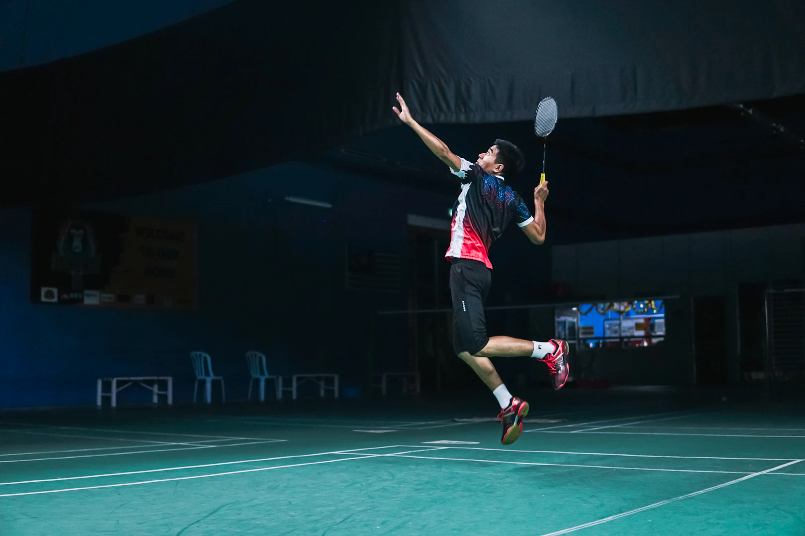 Pickleball court with paddle and ball