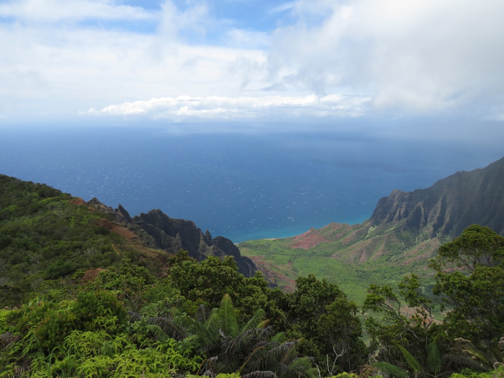 green mountains under white clouds during daytime