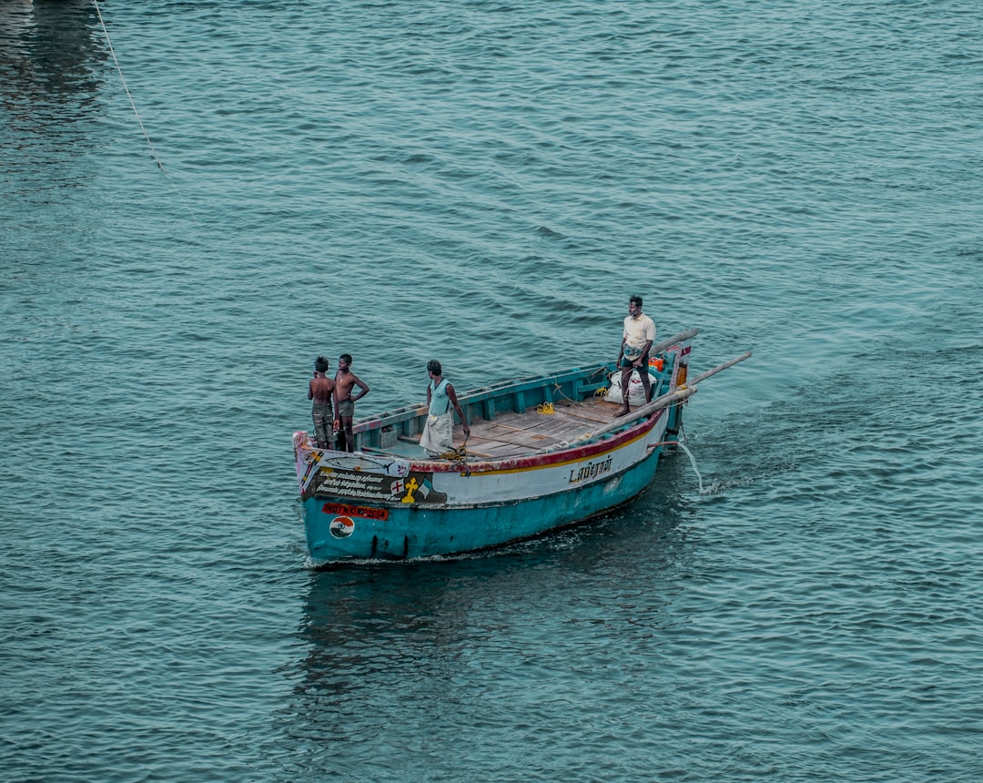 2 men and woman riding on boat on sea during daytime